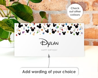 May include: A rectangular white birthday card featuring a top border of black Mickey Mouse silhouettes, colorful party hats, balloons, and gifts. The center displays the name Dylan in a stylized font above the text HAPPY BIRTHDAY.