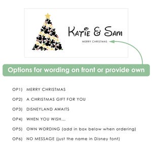 May include: A rectangular graphic featuring a Christmas tree composed of black, gold, and white circular icons, topped with a gold star. The text reads Katie & Sam and MERRY CHRISTMAS. Below, a list of six text options for customisation is provided.