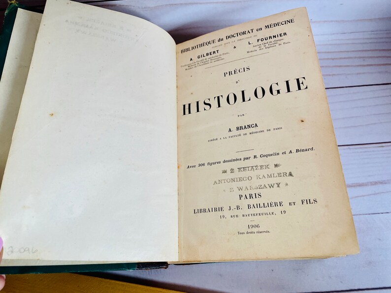 May include: A vintage book titled "Precis d'Histologie" by A. Branca. The book is part of a medical library series and features illustrations by R. Coquelin and A. Benard. It was published in Paris in 1906 by J.-B. Bailliere et Fils.