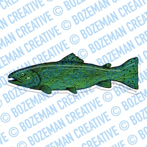 May include: A sticker featuring a stylized illustration of a fish. The fish is primarily green with a pattern of leaves and dark green spots. The fish has a white border and the text "Bozeman Creative" is visible.