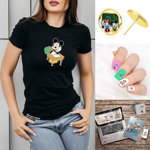 May include: A black t-shirt with a cartoon image of Mickey Mouse sitting at a desk with a backpack and writing with a pencil. The shirt has the text "Shirt not included" on the bottom.