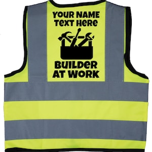 May include: Yellow and grey safety vest with black reflective stripes. The vest has a black patch with the text "YOUR NAME TEXT HERE" and a toolbox with tools, and the text "BUILDER AT WORK".