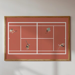May include: A framed print showing a tennis court from above, with four players in action. The court has a reddish-brown surface and white lines. The players are holding rackets. The frame is made of wood.