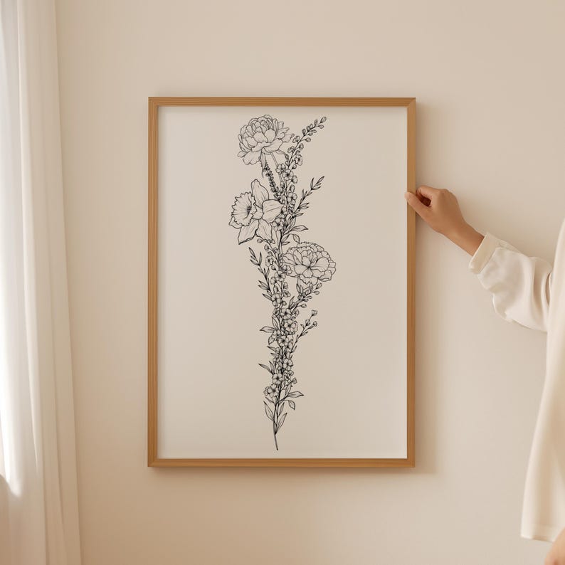 May include: A black and white line drawing of a bouquet of flowers in a vertical arrangement. The flowers include carnations, daffodils, and other small flowers.