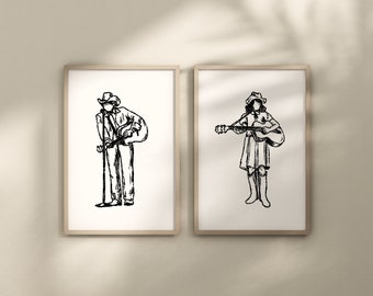 May include: Two framed black and white line drawings of people playing guitars. The person on the left is a man wearing a cowboy hat and holding a microphone. The person on the right is a woman wearing a cowboy hat and holding a guitar.