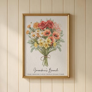 Op de afbeelding: Een ingelijste bloemenprint met een aquarelboeket van rode rozen, oranje klaprozen, madeliefjes en gele narcissen. Het boeket is vastgebonden met touw en bevat een kleine vlinder. De tekst "Grandma's Bunch" staat eronder.