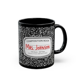 May include: Black ceramic mug with a composition notebook design. The mug features a white label with the text "COMPOSITION BOOK" and "MRS. JOHNSON" in red. The label also includes the text "100 Sheets 200 Pages 9 1/4 in x 7 1/2 in (24.7cm x 19cm)"