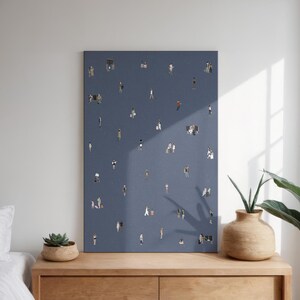 May include: A rectangular wall art print featuring a dark blue background populated with numerous small, illustrated figures of people in various poses, some standing alone and others in small groups, scattered across the entire surface area.