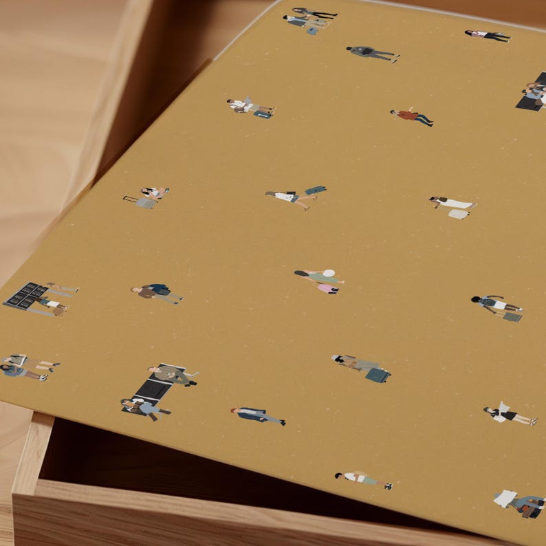 May include: A mustard-colored tray with a repeating pattern of tiny figures in various poses. The figures are dressed in a variety of outfits, and some appear to be carrying briefcases or luggage. The tray is set inside a wooden drawer.