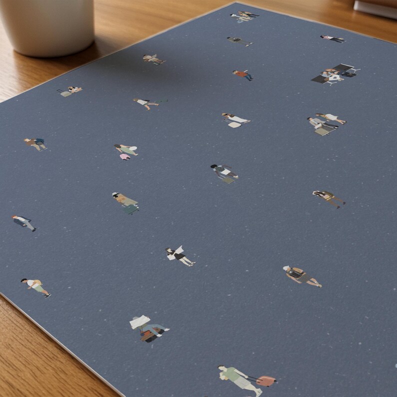 May include: A rectangular desk mat with a dusty blue background featuring a speckled texture and a repeating pattern of tiny, illustrated figures in various poses, including people walking with luggage, sitting at desks, and standing.