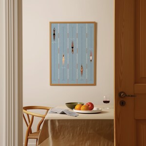 May include: A framed illustration of swimmers in a pool. The swimmers are all women, and they are wearing different colored swimsuits. The pool is blue, and the lanes are marked with white lines. The frame is a light brown wood.