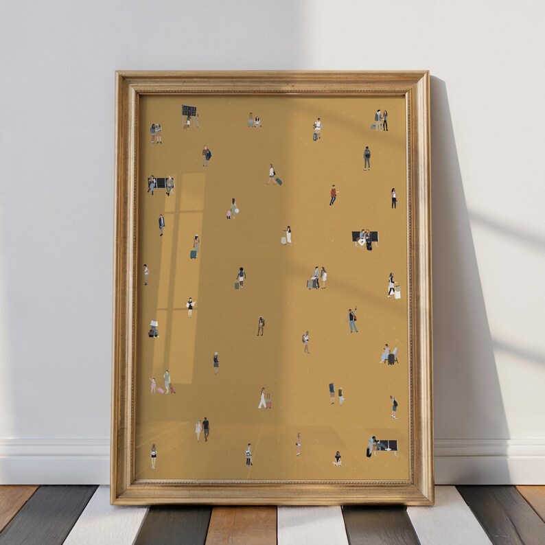 May include: A framed art print featuring a mustard-colored background with numerous tiny figures of people. The figures are dressed in various outfits, some carrying luggage. The frame is a light gold color, and the artwork is displayed against a white wall.
