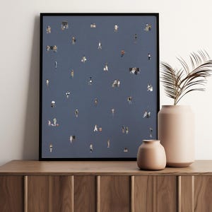May include: A framed wall art print featuring a dark blue background populated with numerous small, illustrated figures of people in various poses, some standing, walking, or sitting, creating a scattered pattern across the entire surface.
