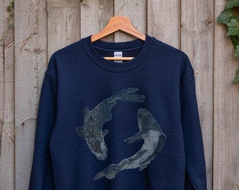 Upcycled denim Pisces gift, A Denim Embroidered Sweatshirt with the Pisces horoscope symbol of two fish, perfect for a personalised gift.