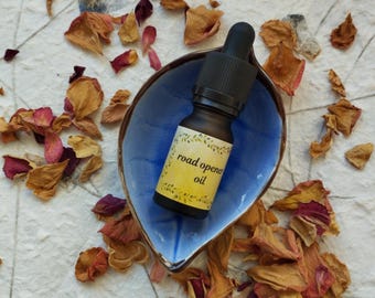 Road opener anointing oil for candles, poppets, spells. 10ml in a bottle with dropper, made with all natural ingredients, witchcraft supply