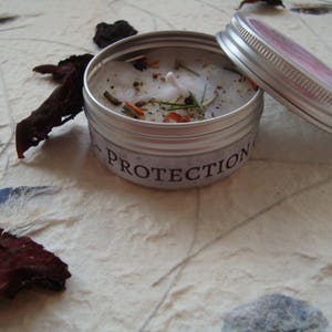 Homemade protection candle in a tin made with a paraffin, beeswax mix, herbs and oils -tool for witchcraft - for witches, pagans and wiccans