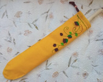 Handmade mustard yellow wand case made with felt, with a hanging string and vine embroidery - perfect gift for witches, pagans and wiccans
