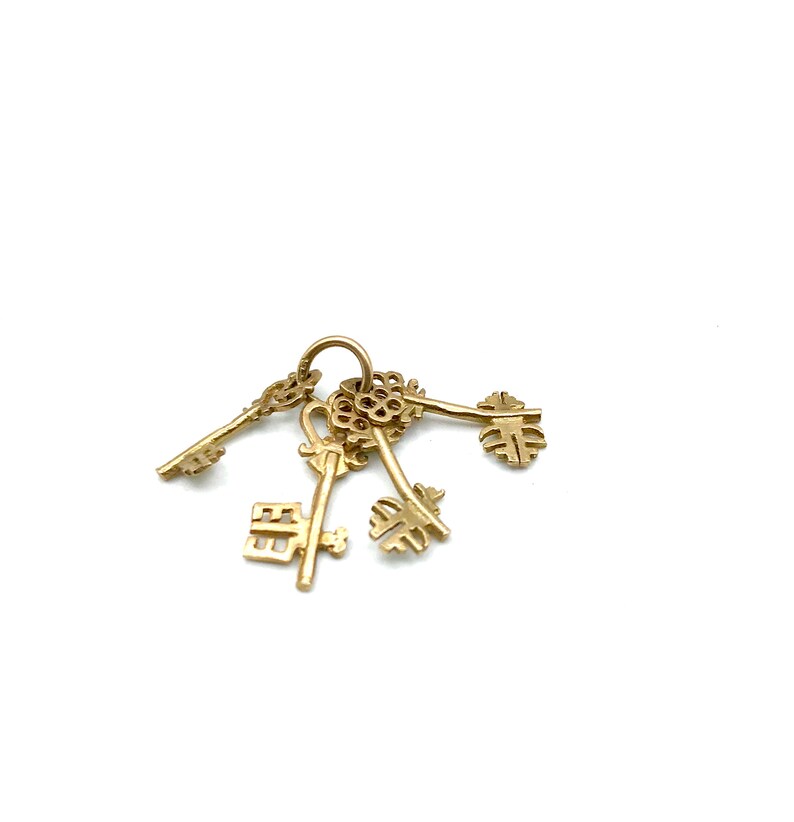 Set of 4 Skeleton Key Charms on a Ring 9KT Gold