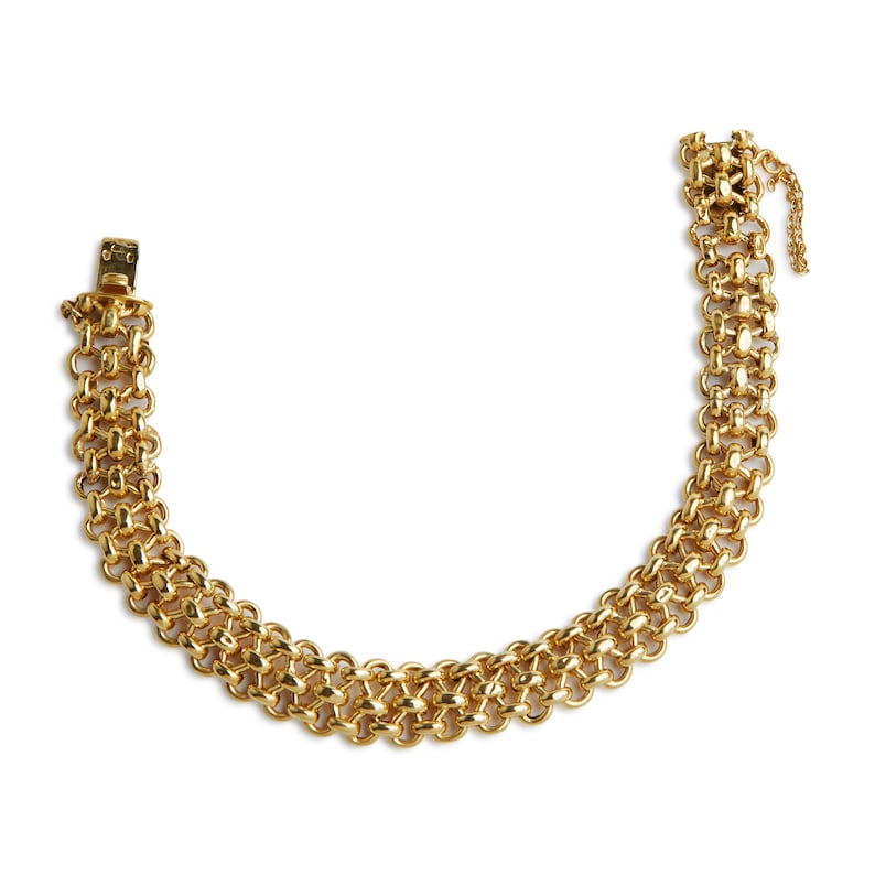 May include: A gold chain bracelet with a woven design. The bracelet has a clasp closure.