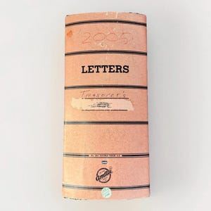 May include: A vintage ledger book with a peach cover and black horizontal stripes. The cover reads "LETTERS" in bold black letters, with the word "Treasurer's" below. The number "2005" is handwritten at the top.