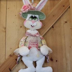 the cutest Easter bunny all decked out  with her Easter hat and false Eye lashes ready to go to town