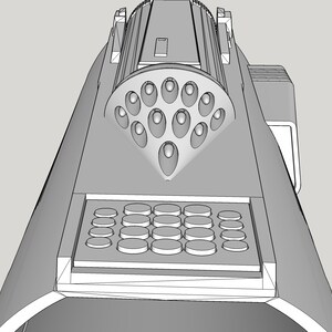 May include: A black and white line drawing of a futuristic weapon with a circular array of small holes and a grid of buttons.
