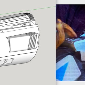 May include: A silver-colored, futuristic-looking weapon with a cylindrical body and a nozzle at the end. The weapon has a series of vents and grooves along its surface.