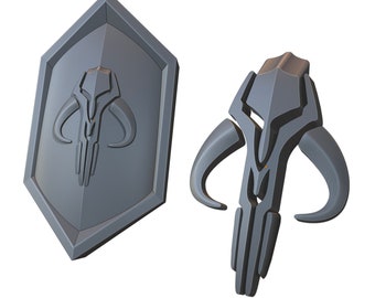 May include: A 3D printed Mandalorian symbol, also known as the "Mudhorn", in two different styles. One is a shield shape and the other is a more stylized version of the symbol.