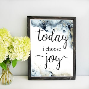 May include: A framed print with a blue and gold watercolor background. The print features the text "today i choose joy" in black cursive lettering.