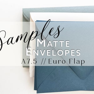 May include: A stack of A7.5 matte envelopes with Euro flaps in shades of blue, gray, and white. The text "Samples MATTE ENVELOPES A7.5 // Euro Flap" is overlaid on the image. The envelopes are arranged in a layered pile, showcasing the different colors.