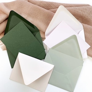 A2 card and envelope sets from Onvalop offered in 48 colors. Dusty Green, Snow, Rain, and Powder Pink shown here. Order blank or printed.