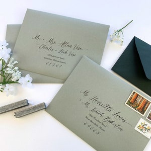 Sage green envelopes printed in black ink with addresses and calligraphy style font