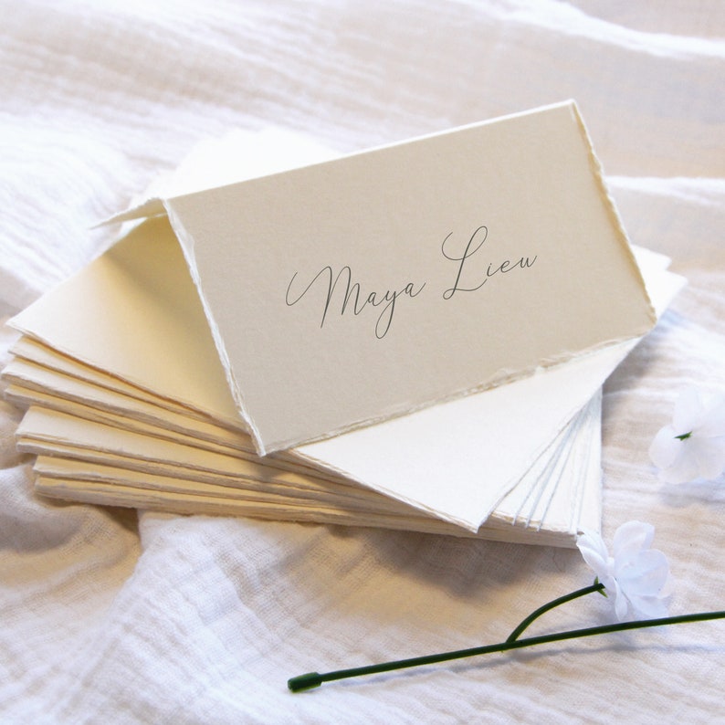 Cream deckled edge place card with calligraphy