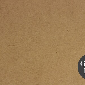 May include: A close-up of a brown paper bag with the text "Grocer Kraft" printed in white on a black circle.