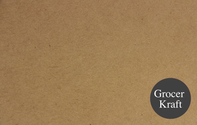 May include: A close-up of a brown paper bag with the text "Grocer Kraft" printed in white on a black circle.
