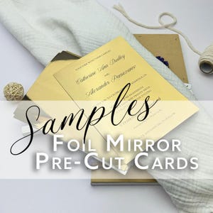 May include: Samples of gold foil mirror pre-cut cards. The cards are blank and ready to be personalized. The text on the card reads "Together with their families, Catherine Ann Dudley and Alexander Pamazanou invite you to celebrate their marriage on June eighteenth, two thousand and twenty sixth at seven in the evening. Ceremony and dancing to follow."