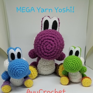 May include: Three crocheted Yoshi figures in blue, purple, and green. The purple Yoshi is the largest, with the text "MEGA Yarn Yoshi!" above. The text "AyuCrochet" is below. Each figure has white eyes, and yellow and white accents.
