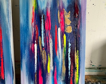 May include: Abstract painting on canvas with vertical brushstrokes in various colors, including blue, pink, yellow, white, and gold. The background is a light blue with hints of purple.