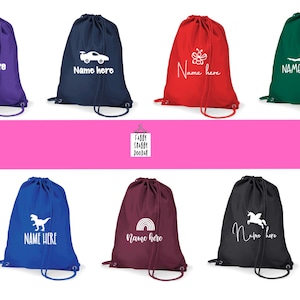 May include: Drawstring bags in purple, navy, red, and green, each with a white graphic and the words "Name here." Other bags are blue, burgundy, and black, with different designs. The bags are for carrying items.