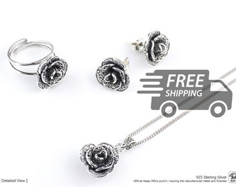 May include: A jewelry set consisting of a sterling silver ring, two stud earrings, and a pendant necklace, each featuring a detailed rose design with oxidized accents. The ring has an adjustable open band, and the necklace includes a fine chain.