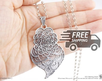 May include: A silver pendant necklace featuring an intricate filigree rose design. The pendant is crafted from 925 sterling silver and hangs from a matching silver chain. The metalwork displays a detailed, layered floral pattern.