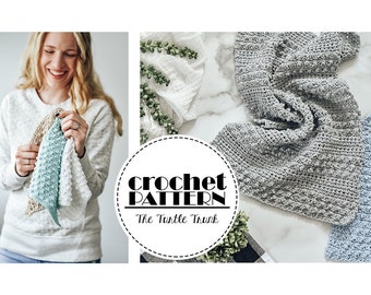 May include: Crochet pattern for a "Turtle Trunk" dishcloth. The image shows three dishcloths in different colors: white, gray, and blue. The dishcloths are made with a textured stitch.