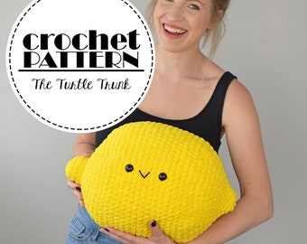 May include: A crochet pattern for a yellow lemon-shaped stuffed toy. The pattern is called "The Turtle Trunk".