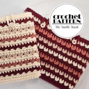 May include: Two crochet cases in a chevron pattern. One is held by a hand. The cases are cream, burgundy, and tan. Each case has a button closure. The text "crochet PATTERN The Turtle Trunk" is in a white circle in the upper right corner.