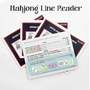 May include: A stack of Mahjong Line Reader cards with the text "Mahjong Line Reader" at the top. The cards have a black and red border with the text "OFFICIAL ST" and "2025". The bottom card has a teal border with Mahjong tiles and the initials "HKM".