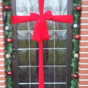Red bow with ribbon for front door, building entry, inauguration