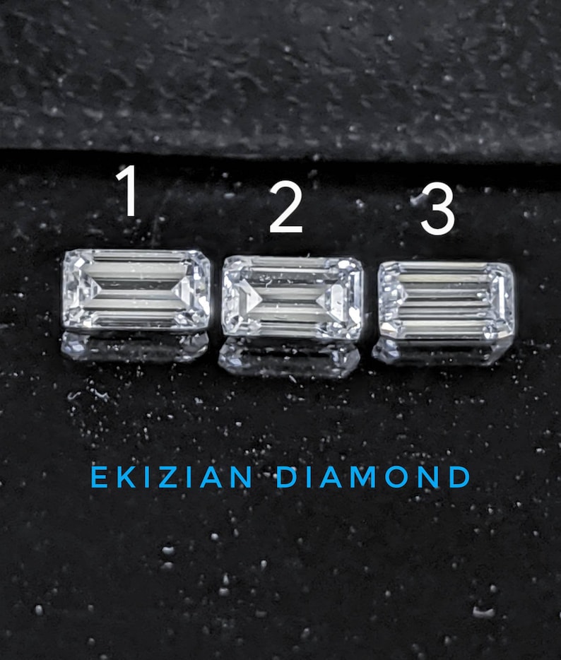 May include: Three emerald cut diamonds labeled 1, 2, and 3 on a black background. The text "EKIZIAN DIAMOND" is below the diamonds.