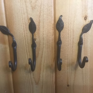 Forged iron leaf hooks group of four