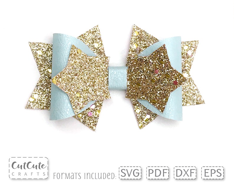May include: A light blue bow with gold glitter stars. The bow is made of felt and has a layered design. The bow is perfect for adding a touch of sparkle to any outfit.