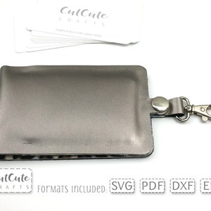 May include: A silver gray leather key chain with a metal clasp. The key chain is designed to hold a small card or ID. The image includes the text "CutCute Crafts" and "Formats Included: SVG PDF DXF EPS".